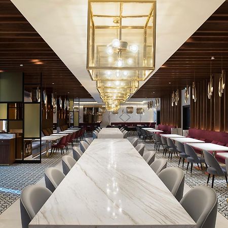 Dusit Doha Hotel Экстерьер фото The interior of the lounge